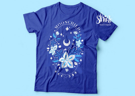 Blue shirt with Moonchild theme. Frasurbane-style central drawing with flowers and cosmic elements, Moonchild&quot text above, lunar phases below.